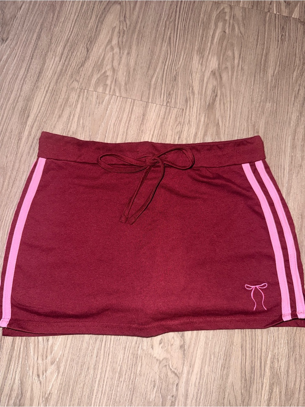 Bow-Accent Burgundy Mini Skirt with Pink Trim